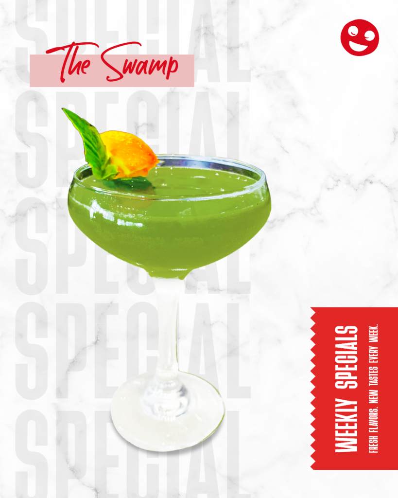 The Swamp, a green tequila cocktail garnished with basil and citrus.